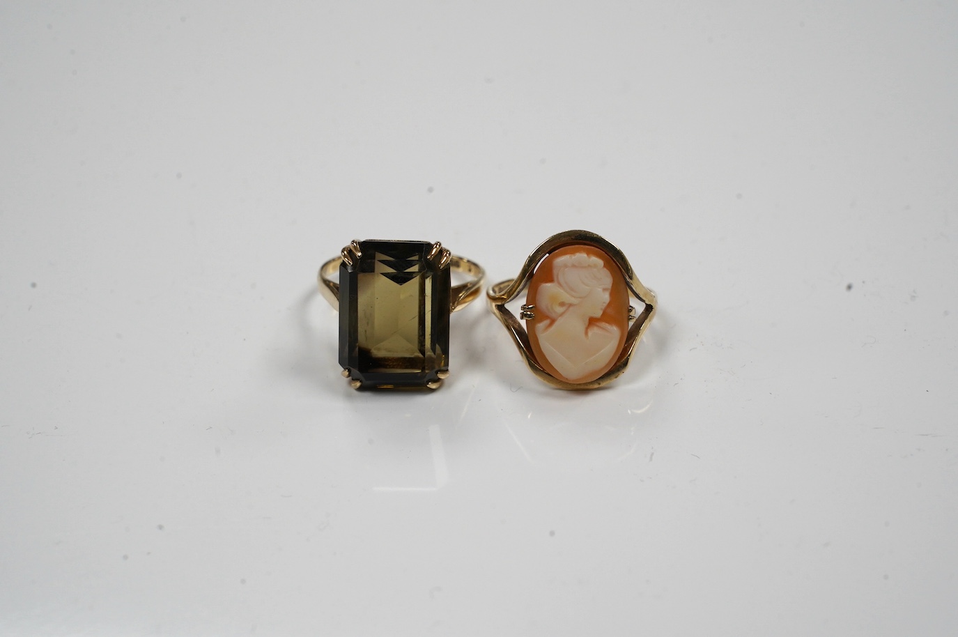 Two 9ct gold and gem set rings to include citrine and cameo shell, gross weight 8.6 grams. Condition - fair to good